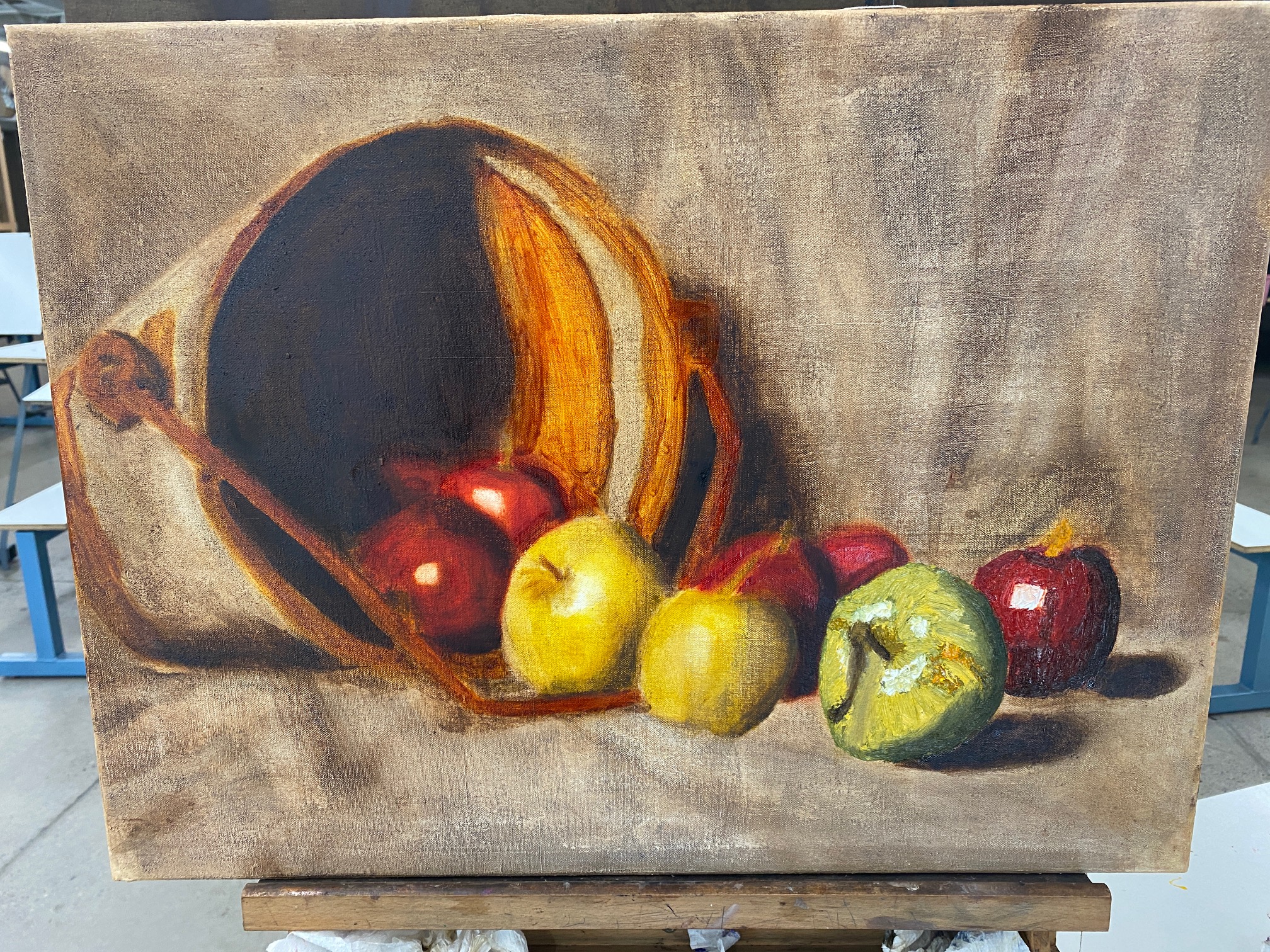 Oil painting of a bucket with apples